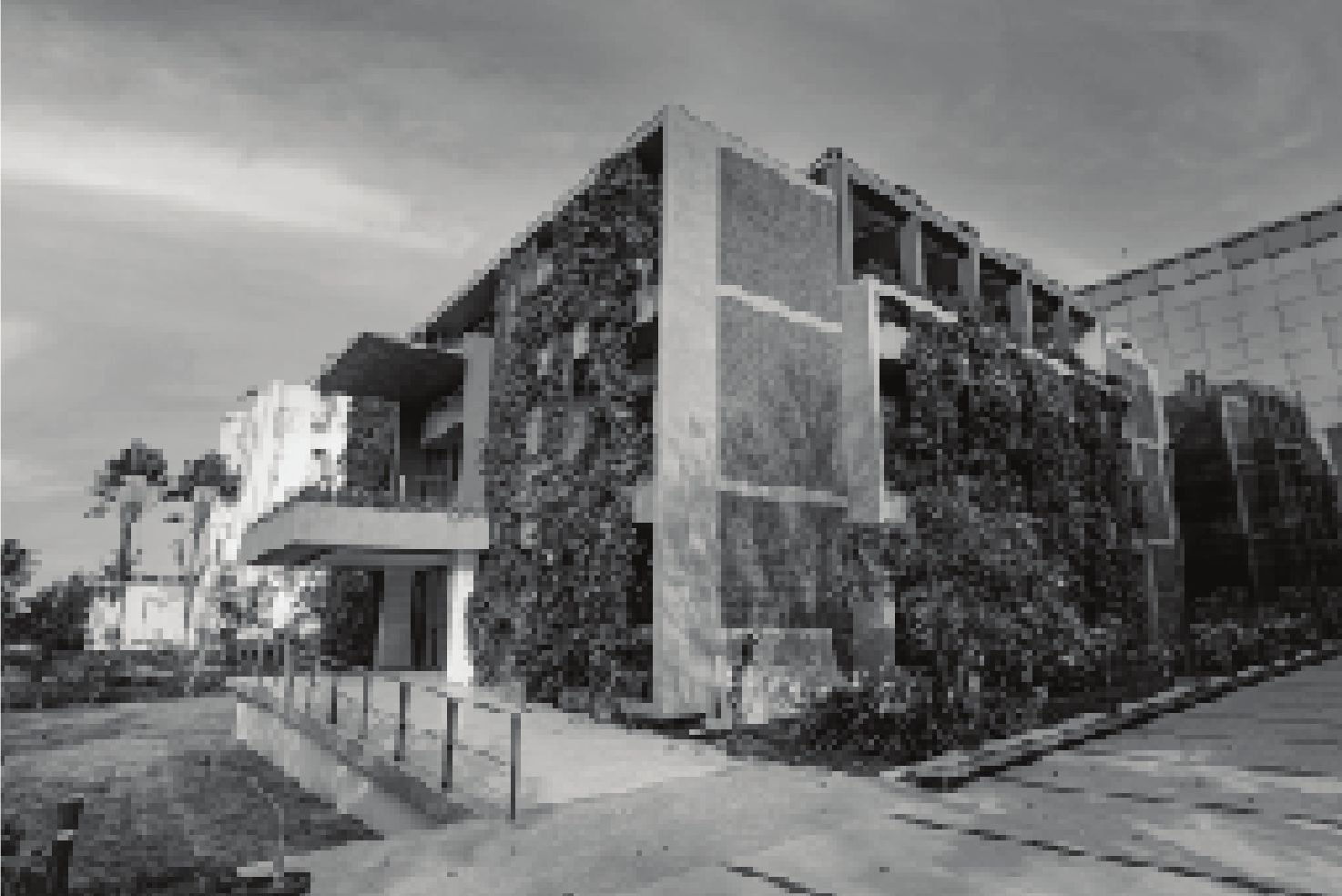 Emerald manufacturing building with a living green façade